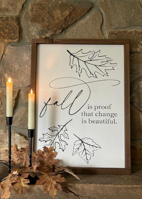 Fall is proof that change is beautiful framed farmhouse sign. White with black design and dark walnut frame