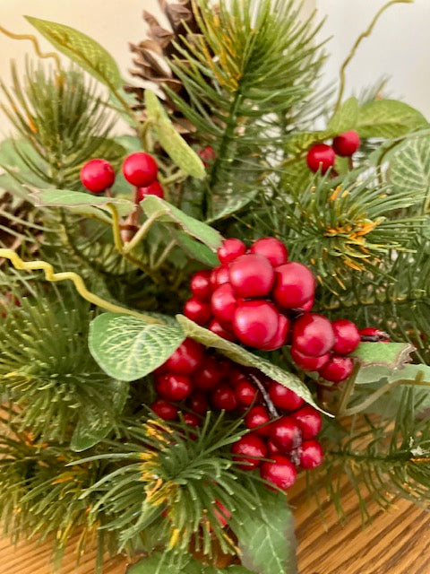 Closeup of the mix of pine berries and holly leaves