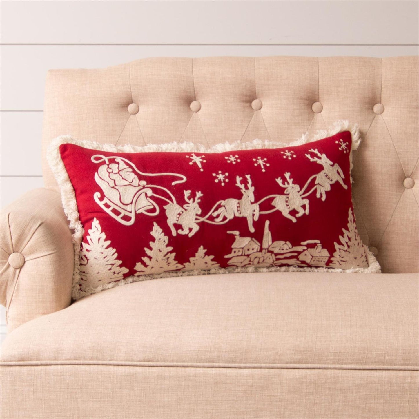Santa Sleigh Lumbar Pillow red background with white fringe with a embroidered vintage santa and sleigh design.