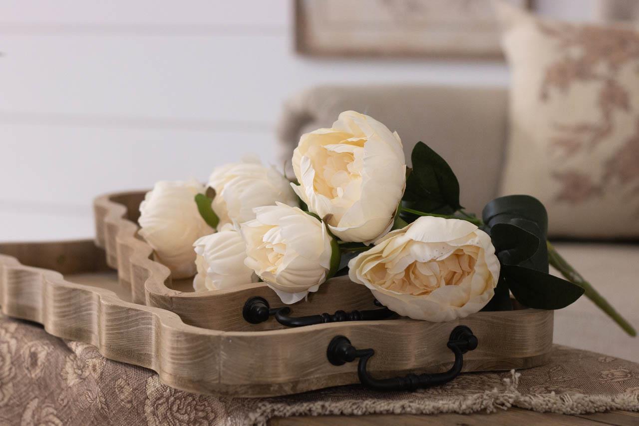 Rectangular scalloped edge wood tray in a natural wood finish with black metal handles.