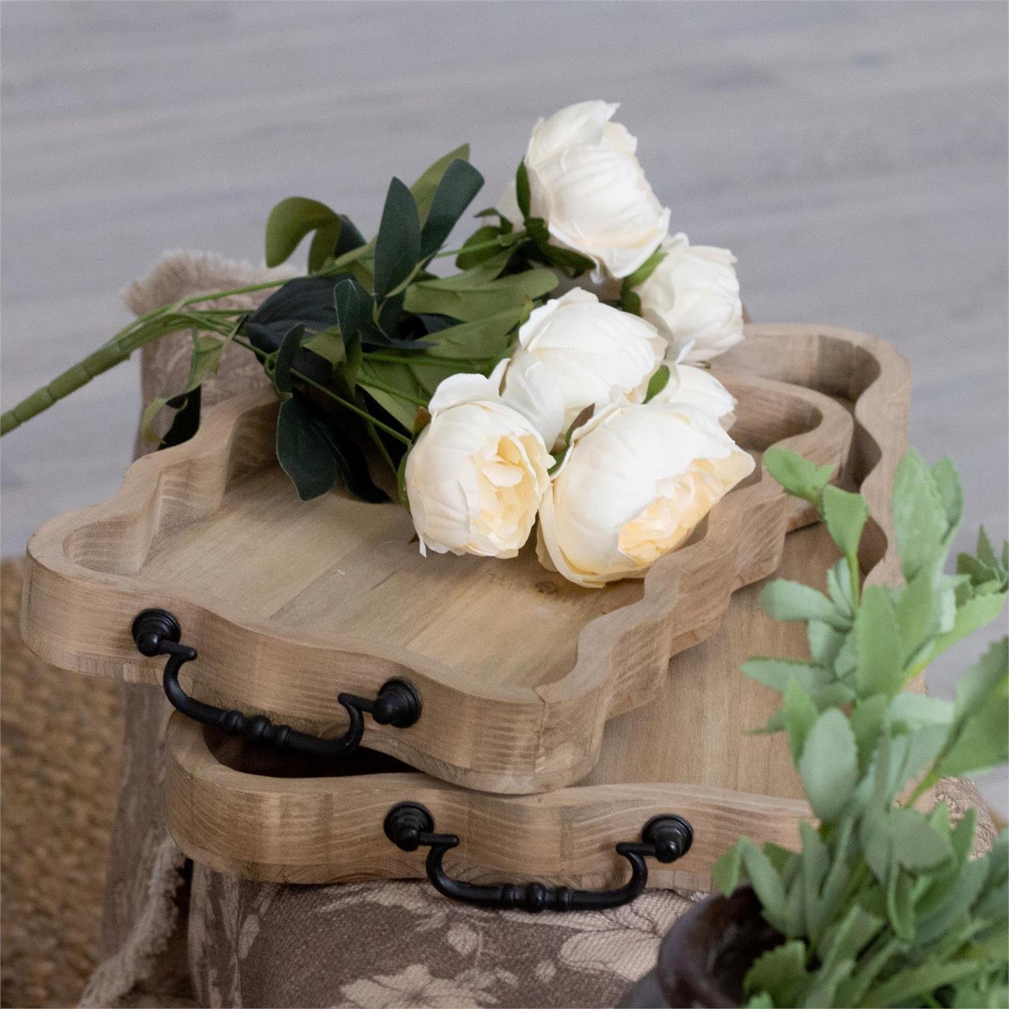 Scalloped edge wood tray, choose small or large. this tray is rectangular with a scalloped edge with black metal handles. this tray is a natural wood color.