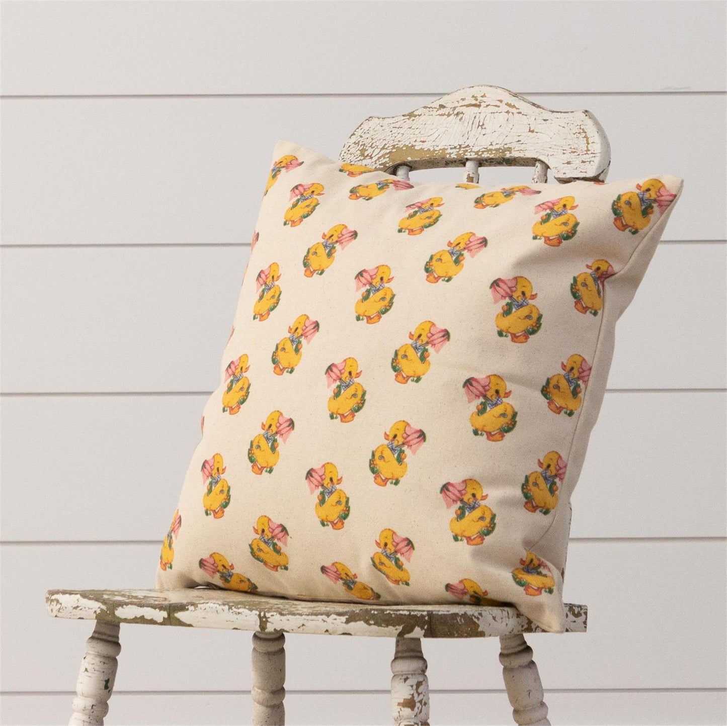 Shows the reverse side of pillow with an all over pattern of the vintage duck.