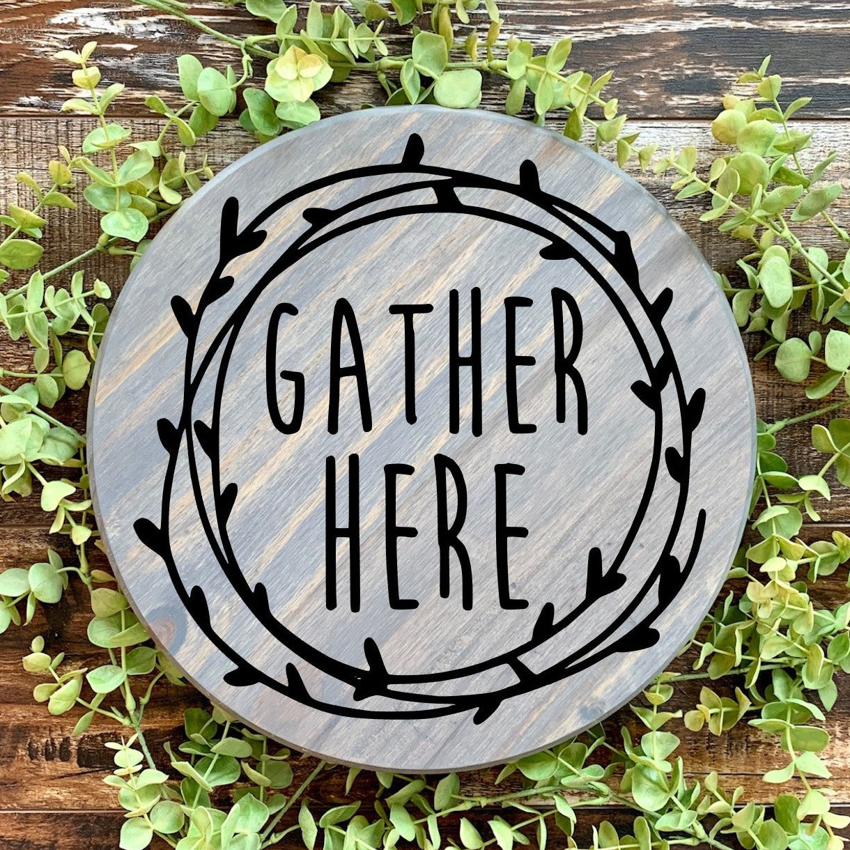 Gather here round sign gray stain with black letters