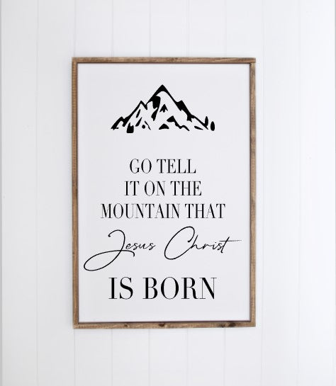Go tell it on the mountain white with black letters