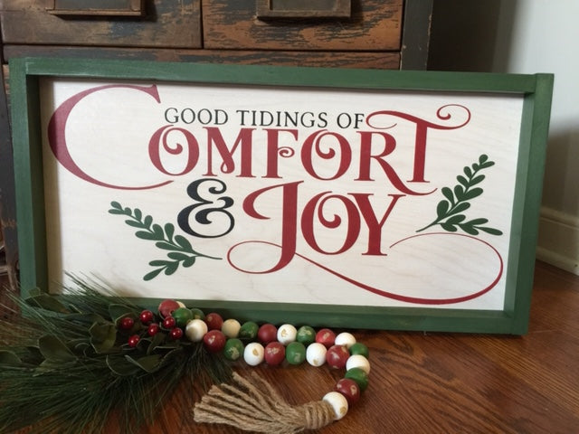 Good tidings of comfort and joy framed sign with red, green and black font colors