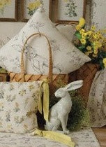 Rabbit and wildflowers throw pillow in display
