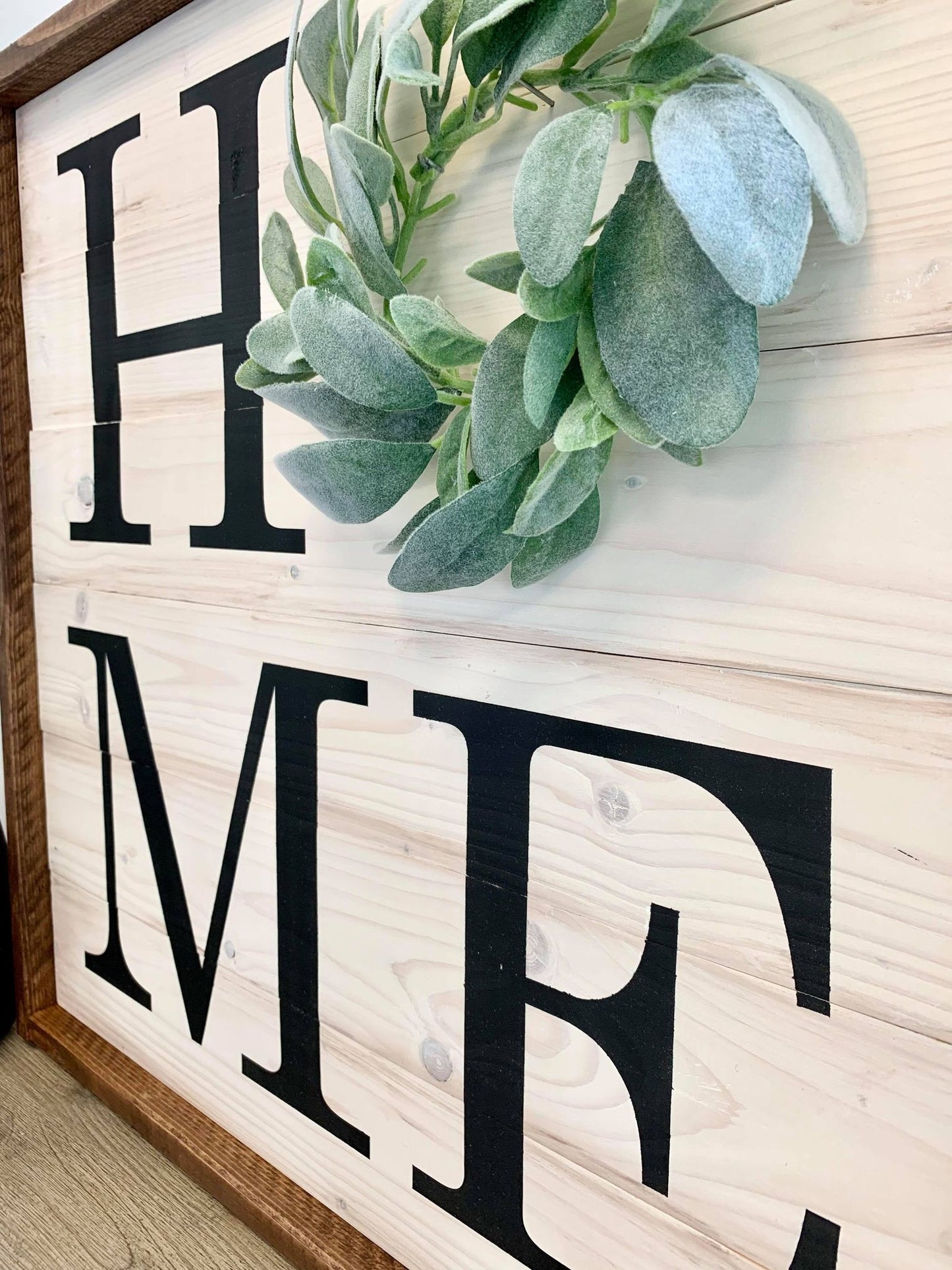 Home sign with floral wreath