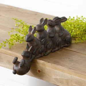 Rabbits playing shelf sitter