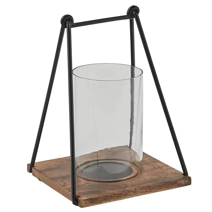 Black metal bar and loop design lantern with square wood base with groove for holding glass cylinder.