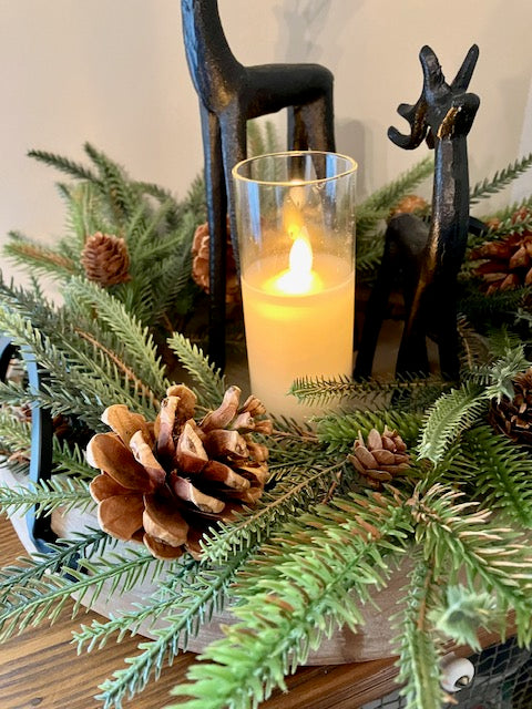 Close up of candle ring to show texture of the pine and pinecones.