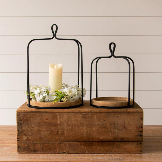 Open Lantern black metal with round wood base. Comes in 2 sizes