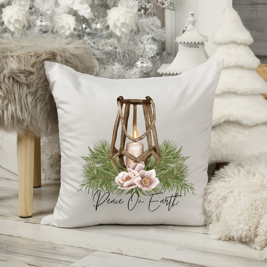 White Canvas Pillow with wooden lantern with Christmas greens and Peace on Earth quote
