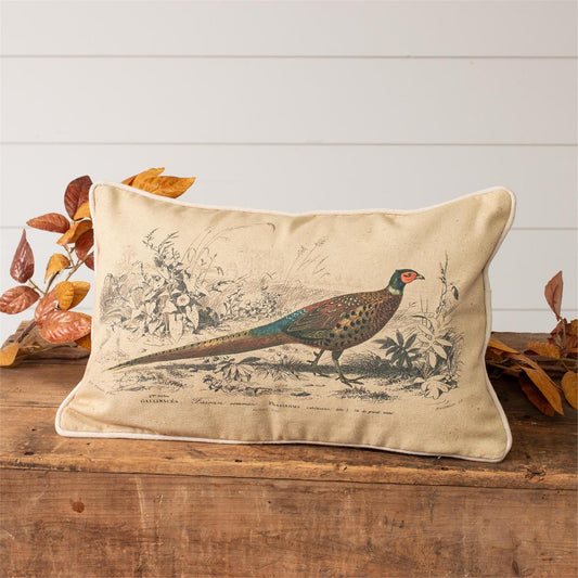 Pheasant pictured walking in a wooded background. This pillow is cream colored cotton fabric. 10" h x 16" w. 