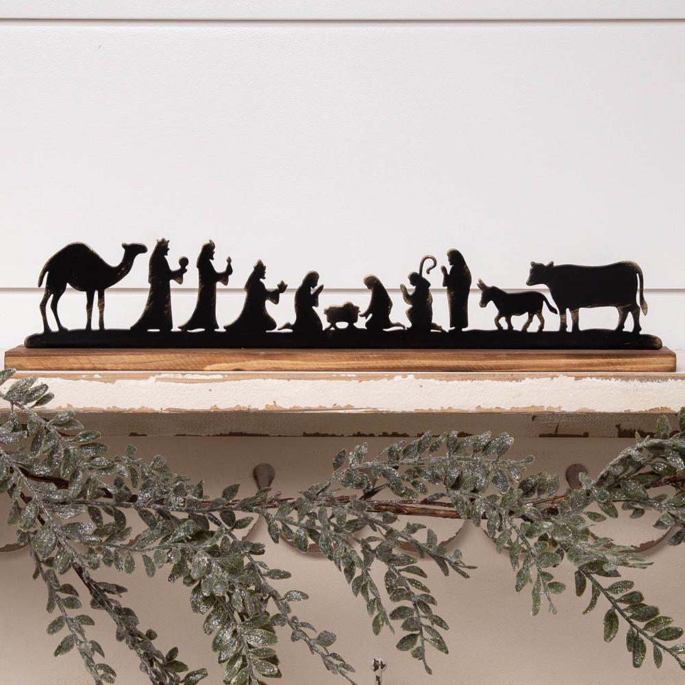 Metal and wood silhouette of the nativity in black 