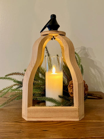 Open wood lantern with black metal finial with ring to hang. Shown with norfolk stem and cream led candle. 