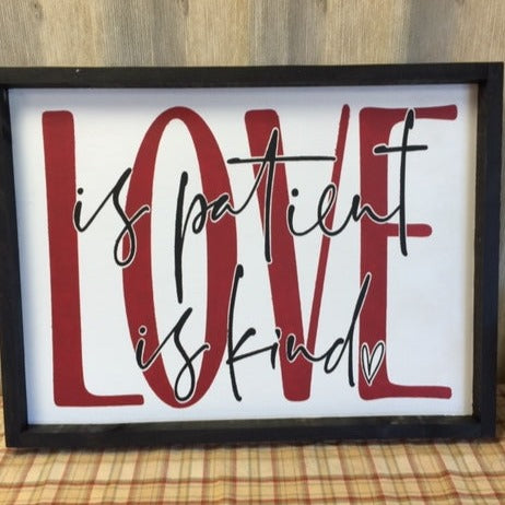 Love is Patient Love is Kind Framed Sign. White background with red love and Black is patient and is kind lettering 